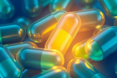 Close-up of mentoto capsules glowing with energy, representing vitality and wellbeing, on a clean background for health product clarity.